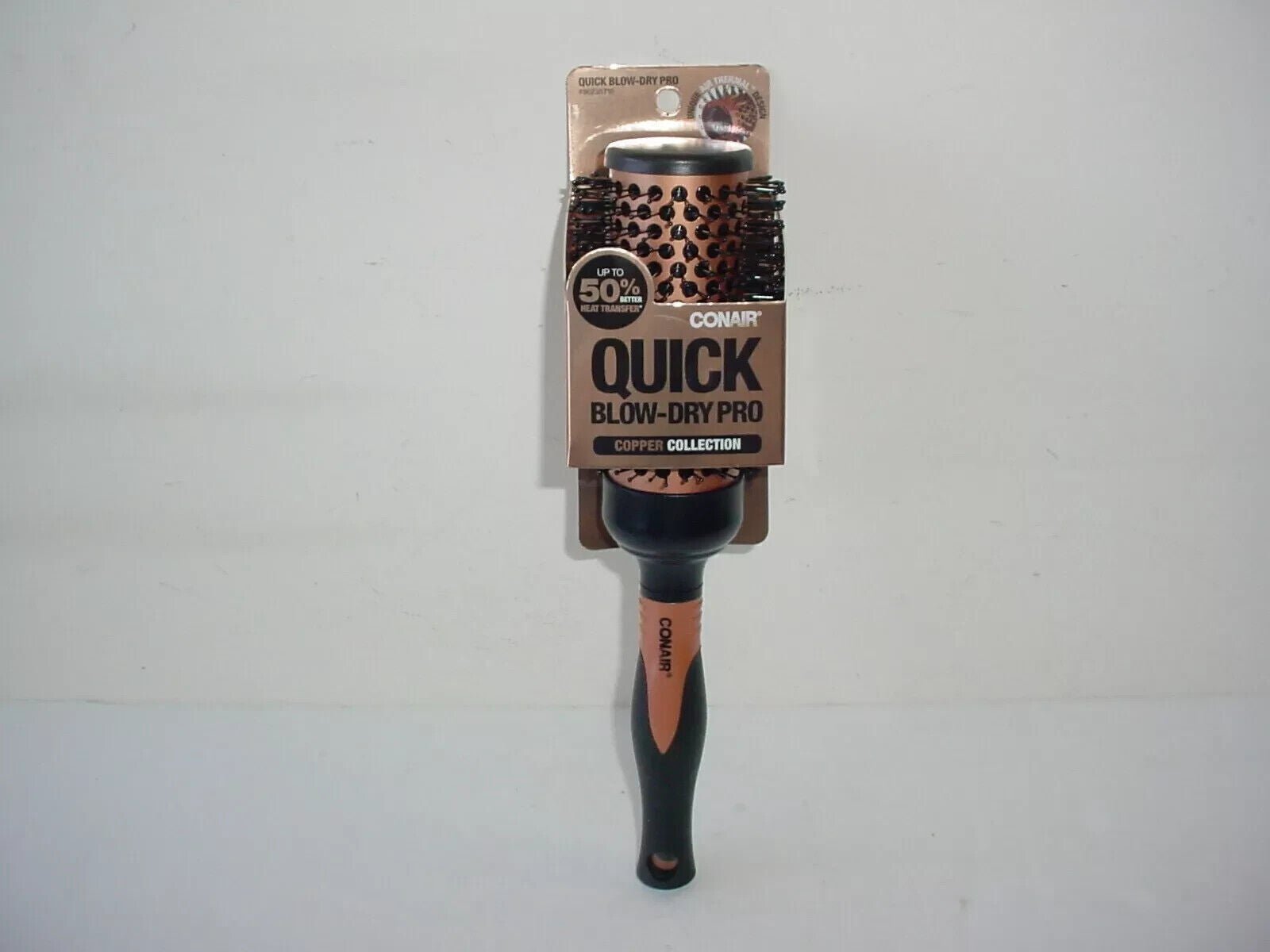 57_10fcdd64-0762-4e79-8611-118d8ca935c4 Conair Quick Blow-Dry Pro Copper Collection Porcupine Round Brush - Image 1